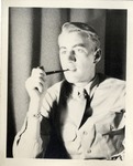 United States Air Force Airman in Uniform, Holding a Tobacco Pipe To His Mouth