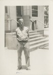 Airman in Uniform Standing In Front of the Barracks