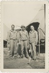 Three Airmen in Uniforms and Jackets Standing in Front of Tents