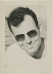 Headshot of a Dark Haired Man in Sunglasses