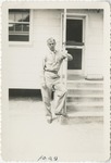 United States Air Force Airman in Leaning on a Porch Handrail