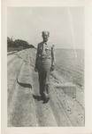 United States Air Force Airman in Uniform Standing on a Concrete Seawall