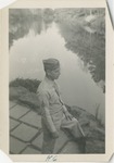 United States Air Force Airman in Uniform and Eyeglasses, Staring at a Pond
