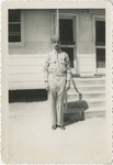 United States Air Force Airman in Uniform Standing in Front of Barracks