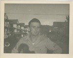 United States Air Force Airman in Uniform, Standing in the Street of the Barracks