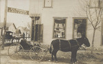 Carriages in front of E. L. Monger Groceries, Hernando, Mississippi