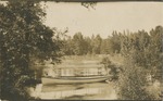 Boat On the Water Surrounded by Trees