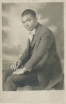 Portrait of a Seated Young African American Man in a Suit