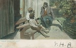 A Man and Two Children Seated Outside