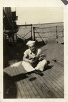 Sailor Seated on the Deck of a Ship, Smoking a Pipe and Playing a Ukulele