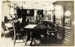 Desk, Table, Chairs, and Cabinetry in the Captain's Cabin of a Navy Ship