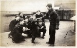 A Sailor Feeding a Bear Cub (A Teddy Bear Mascot), United States Navy