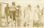 Men in Egyptian Style Costumes on a Ship Deck