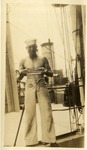 Sailor on Ship Holding a Watermelon