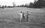 Three men in pasture by Howard Langfitt