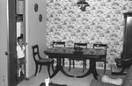 Boy in dining room by Howard Langfitt