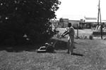 African-American man mowing yard by Howard Langfitt
