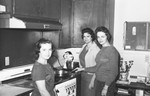 Girls in kitchen 2 [Slide Farm-19] by Howard Langfitt