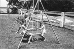 Children swinging by Howard Langfitt