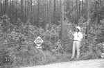 Man trees and sign by Howard Langfitt