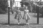Two girls in yard by Howard Langfitt