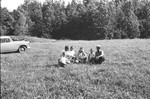 Three men and three boys in field by Howard Langfitt