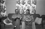 Two men on couch by Howard Langfitt