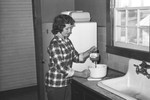 Woman cooking by Howard Langfitt