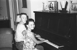 Children playing piano by Howard Langfitt