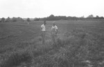 Two men in field by Howard Langfitt