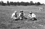 Three men in field 2 by Howard Langfitt