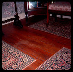 Wooden floor boards and rugs by Doy Payne Longest