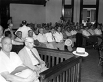 Courtroom scene, Clayton Rand, front row, third from left.