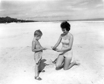 Mother and child at the beach by Arthur Quinn Studio