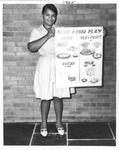 Girl With Food Group Sign
