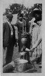 African-Americans with water pump