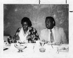 Aaron Henry and Barbara Jordan Eating at a Dinner