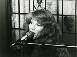 Woman Singing Into a Microphone, undated