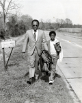 James Meredith and Young Boy Marching, March 2, 1972