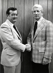 Gilbert E. Carmichael Shaking Hands with Unidentified Man