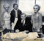 Cliff Finch and Women at a Desk