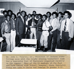 Dr. John Peoples, Jr. with the Trophy Winning Basketball Team