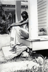 Young Black Man Sitting on a Porch