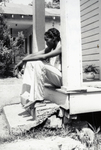 Young Black Man Sitting on a Porch