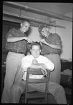 Student Getting Hair Cut by Fred A. Blocker
