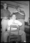 Student Getting Hair Cut by Fred A. Blocker