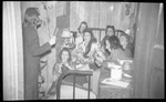 Group of Girls Gathered on Bed Listening to Friend by Fred A. Blocker