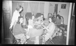 Group of Students Playing Cards in Dorm Room by Fred A. Blocker