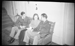 Two Uniformed Men Sitting with Woman on a Bench by Fred A. Blocker
