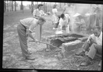 Students Cooking Hot Dogs Outdoors by Fred A. Blocker